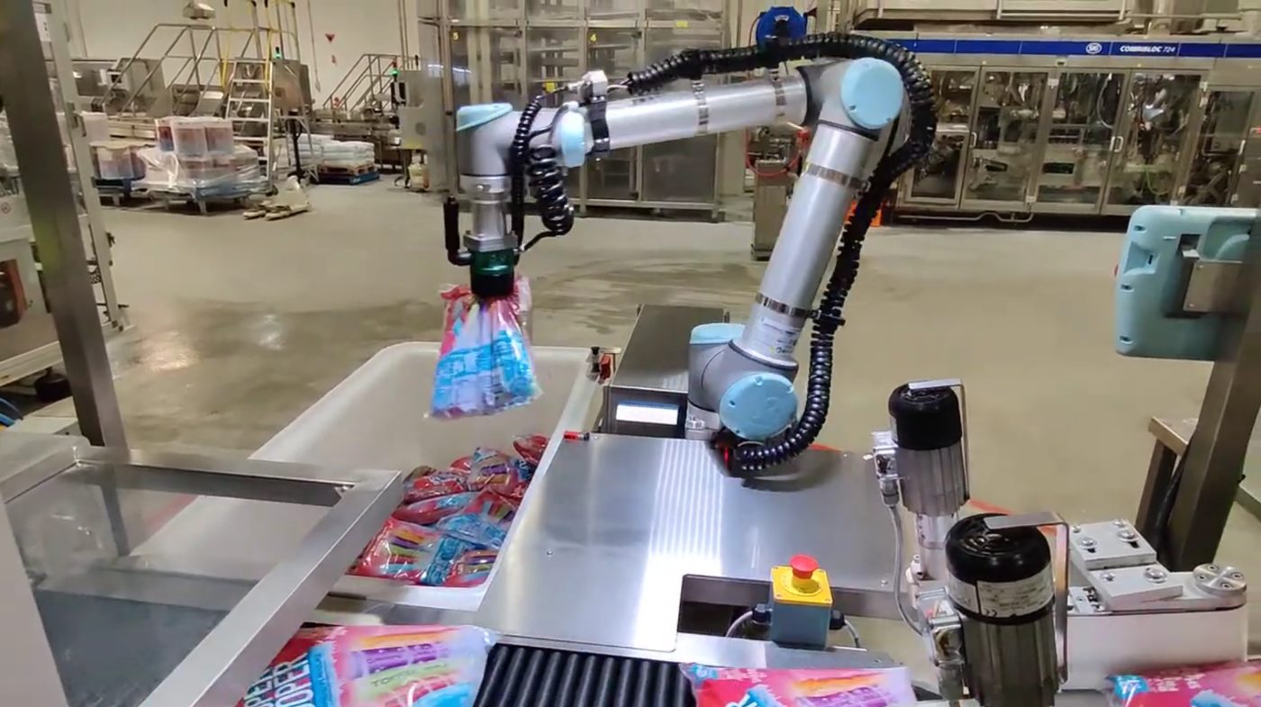 Cobot palletising cartons on a production line